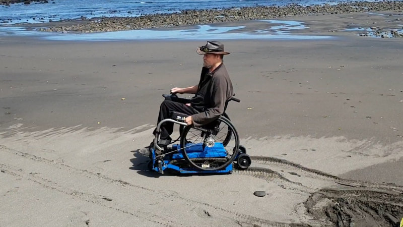 This attachment gives manual wheelchairs motorized off-roading abilities
