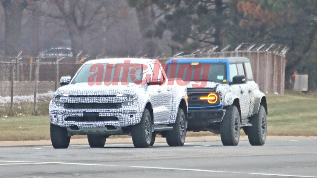 Ford Ranger Raptor caught with less camo next to a Bronco Raptor